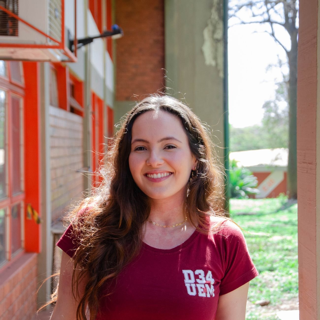 Smiling young woman at a university campus.